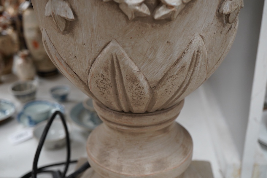 A pair of painted and carved wood lamps, 65cm to wood top